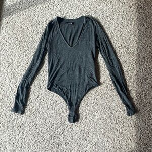 NAKED WARDROBE Deep V-Neck Bodysuit